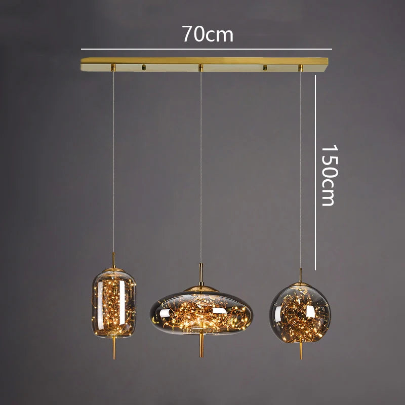 Three pendant lights with measurements on a dark background
