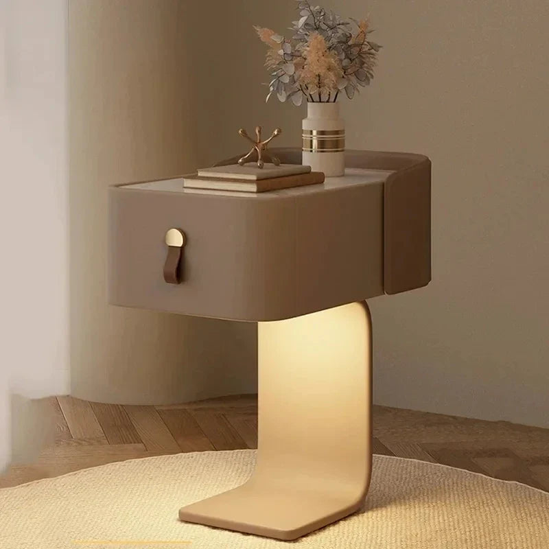 Modern side table with a lighted base in a room setting