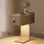 Modern side table with a lighted base in a room setting