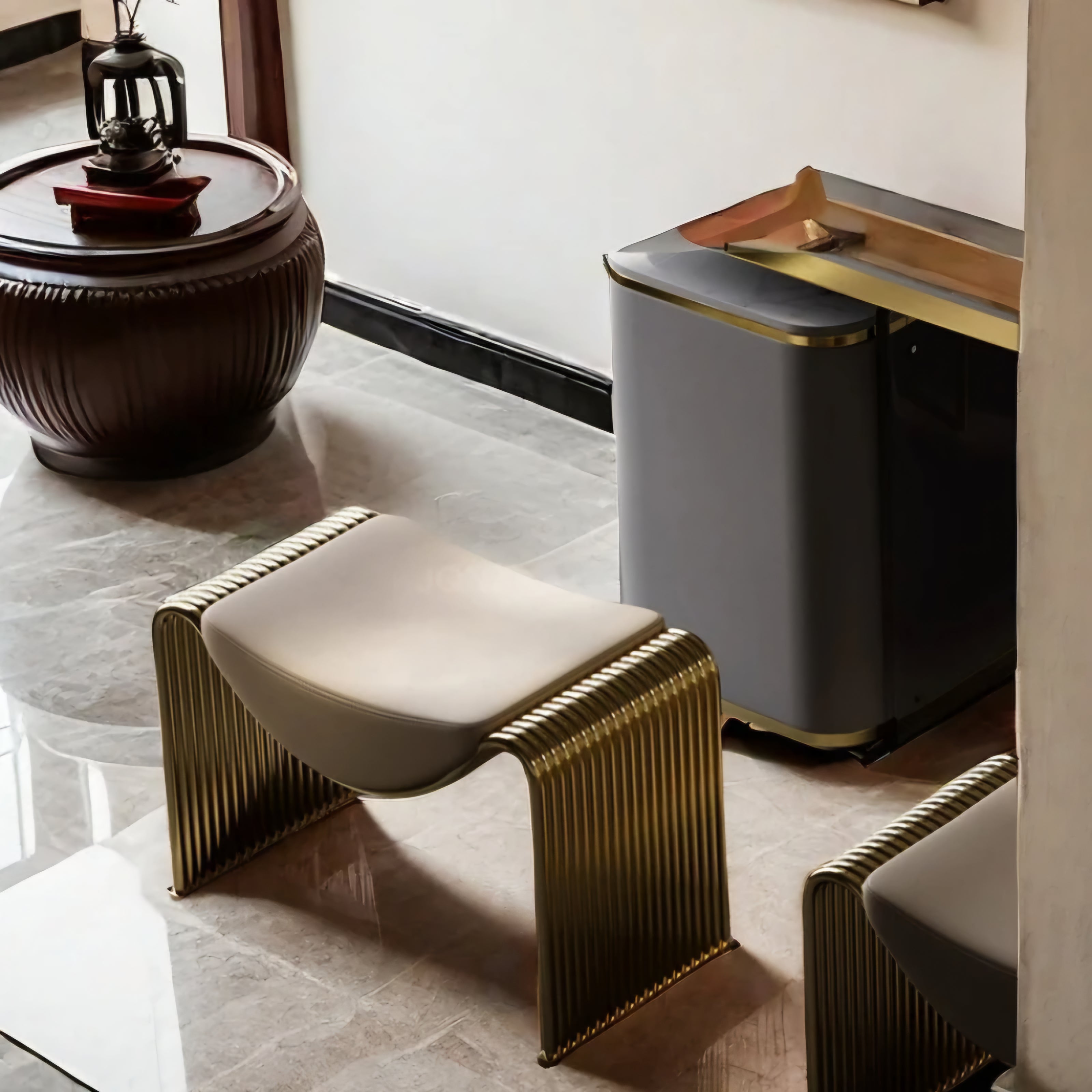 Decorative stool with gold accents in a stylish interior setting