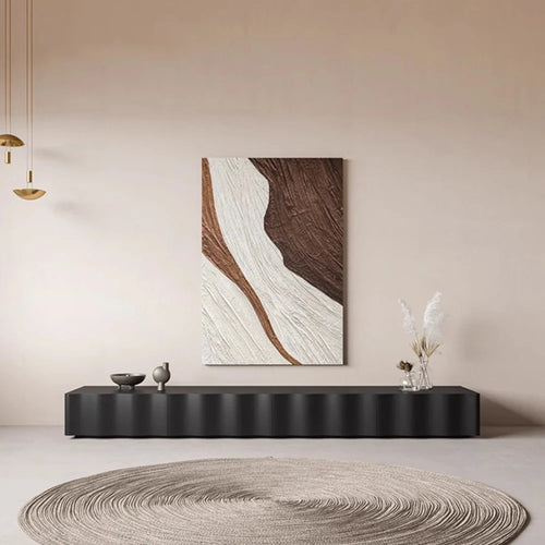 Modern interior with a abstract painting on the wall and a black console table.