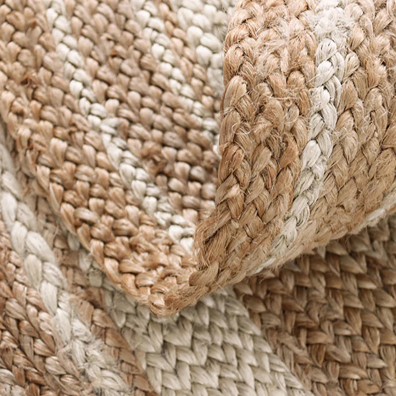 Close-up of a woven jute rug with natural brown and beige colors.