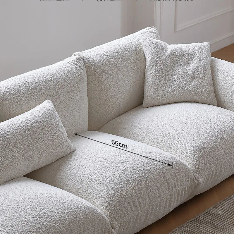 White textured sofa with a measurement label on a neutral background