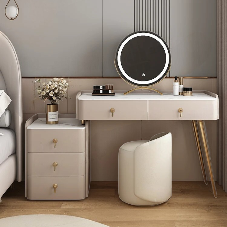 Modern bedroom with a vanity table, stool, and nightstand.