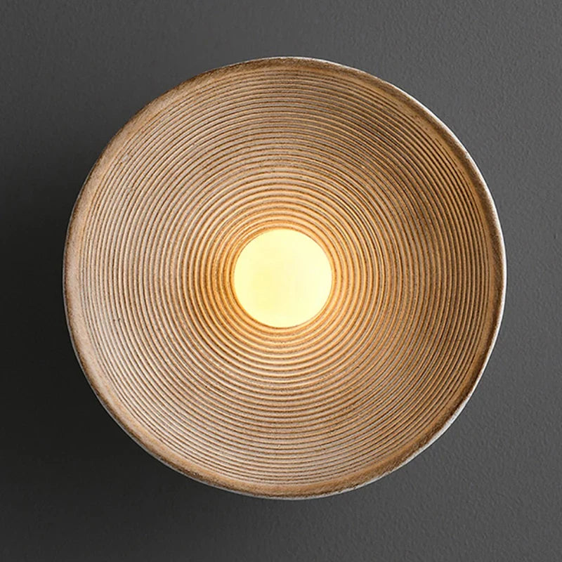 Desert Scandi wall lamp with a minimalist metal design and warm white LED lighting for modern bedrooms and living spaces.