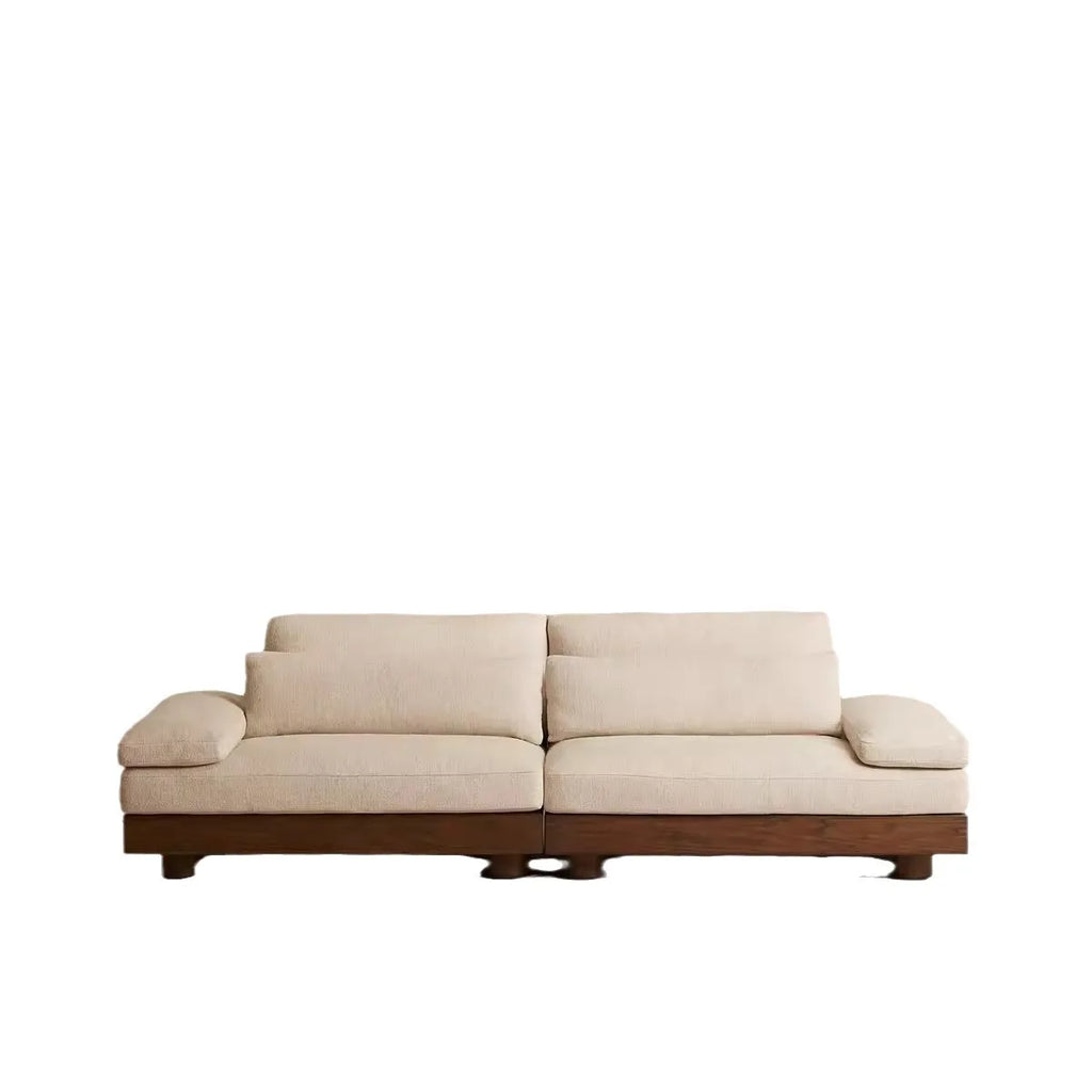 Beige sofa with wooden frame on a white background