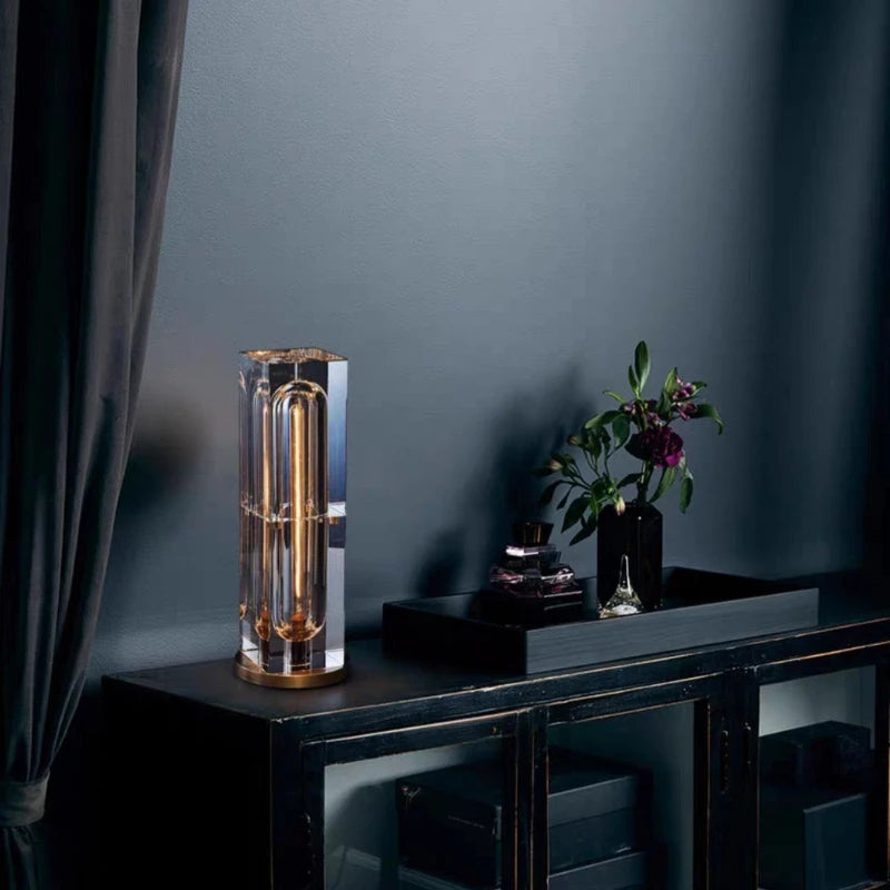 Decorative lamp on a dark surface with a dark wall background