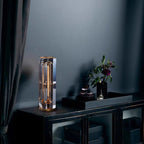 Decorative lamp on a dark surface with a dark wall background