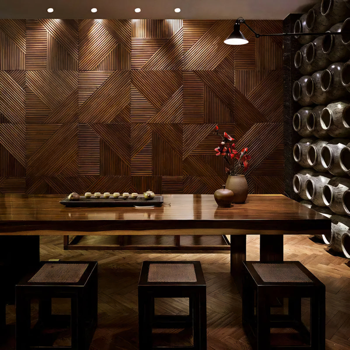 Wooden interior with geometric wall design and a table setup.