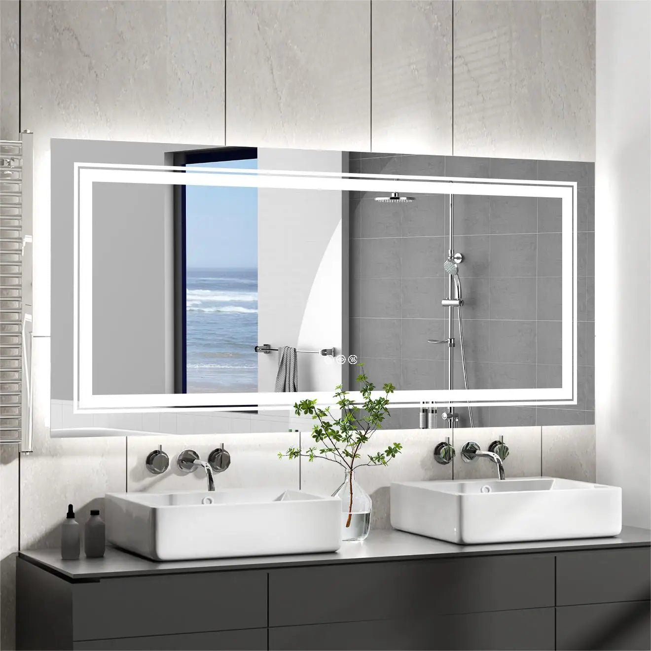 Bathroom with large illuminated mirror above a double sink