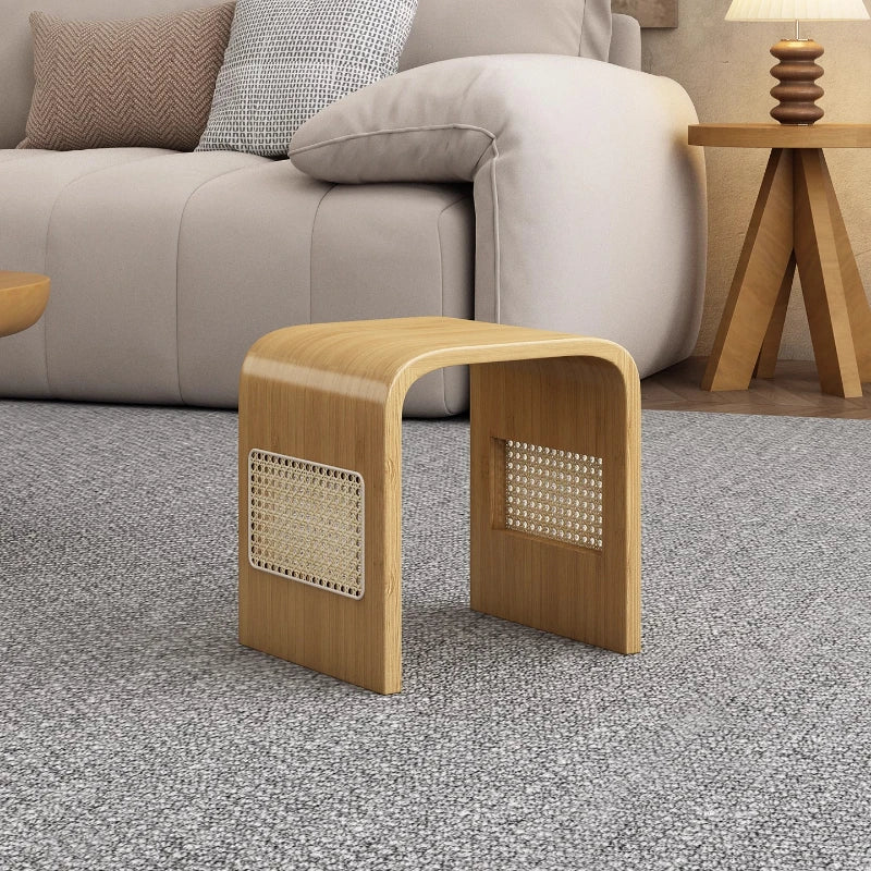 Wooden side table with woven design in a living room setting