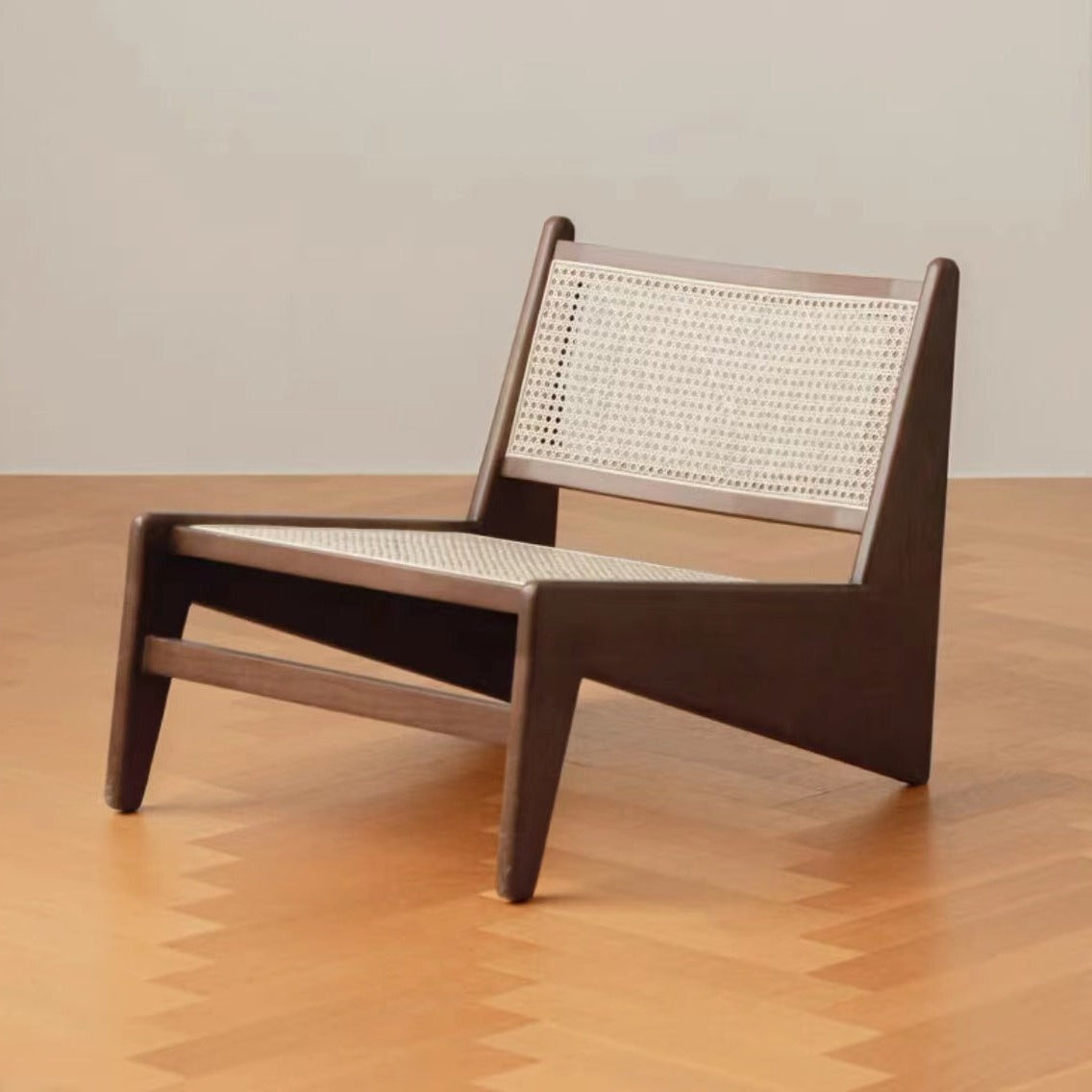 Modern chair with woven backrest on a wooden floor