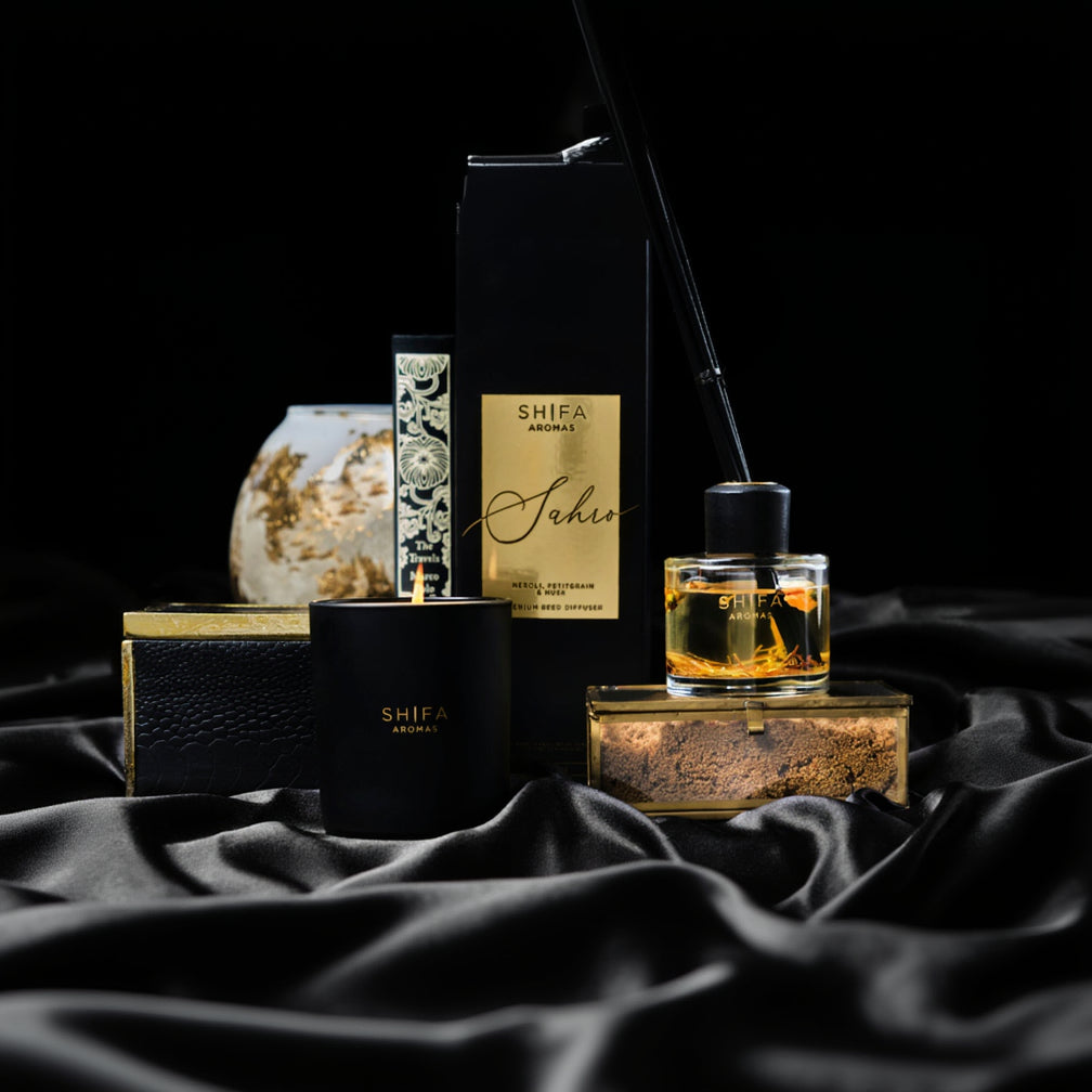 Shifa Aromas products including a candle, diffuser, and packaging on a dark background