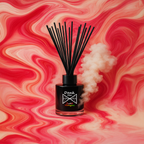 Black diffuser bottle with smoke on a pink and red swirling background
