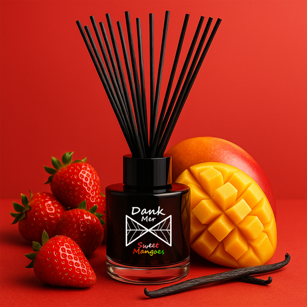 Diffuser with black sticks, strawberries, mango, and vanilla on a red background