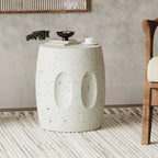 Concrete side table with decorative items in a room setting