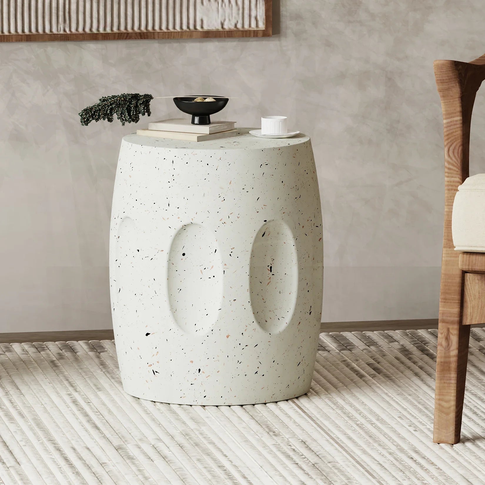 Concrete side table with decorative items in a room setting