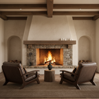 Cozy living room with stone fireplace, wooden mantel, and two brown leather chairs.
