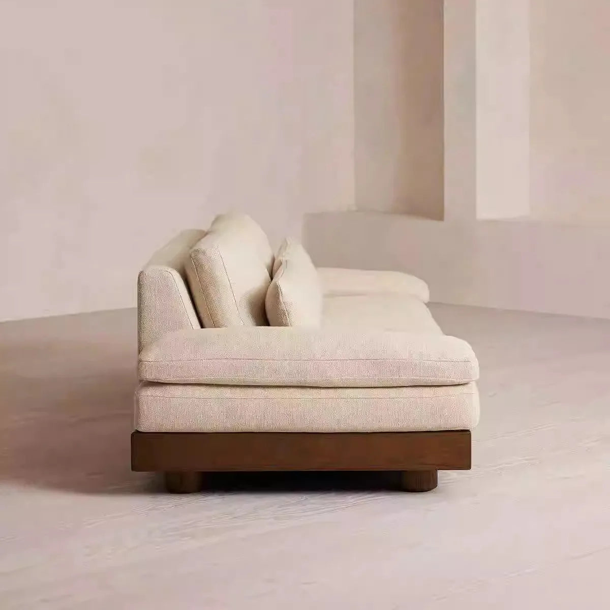 Beige sofa in a minimalistic room with a neutral color palette