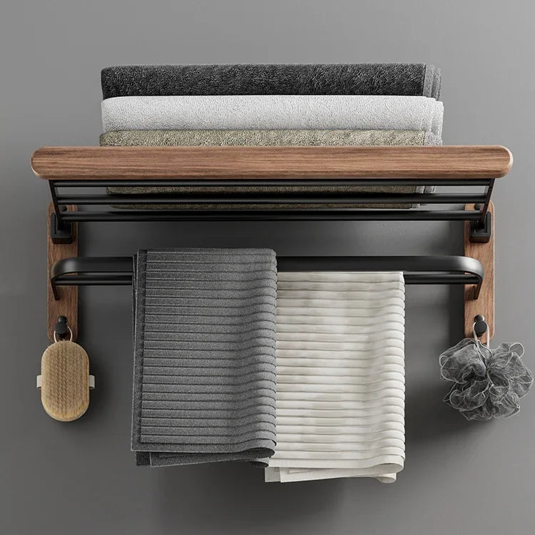 Towel rack with folded towels on a gray wall