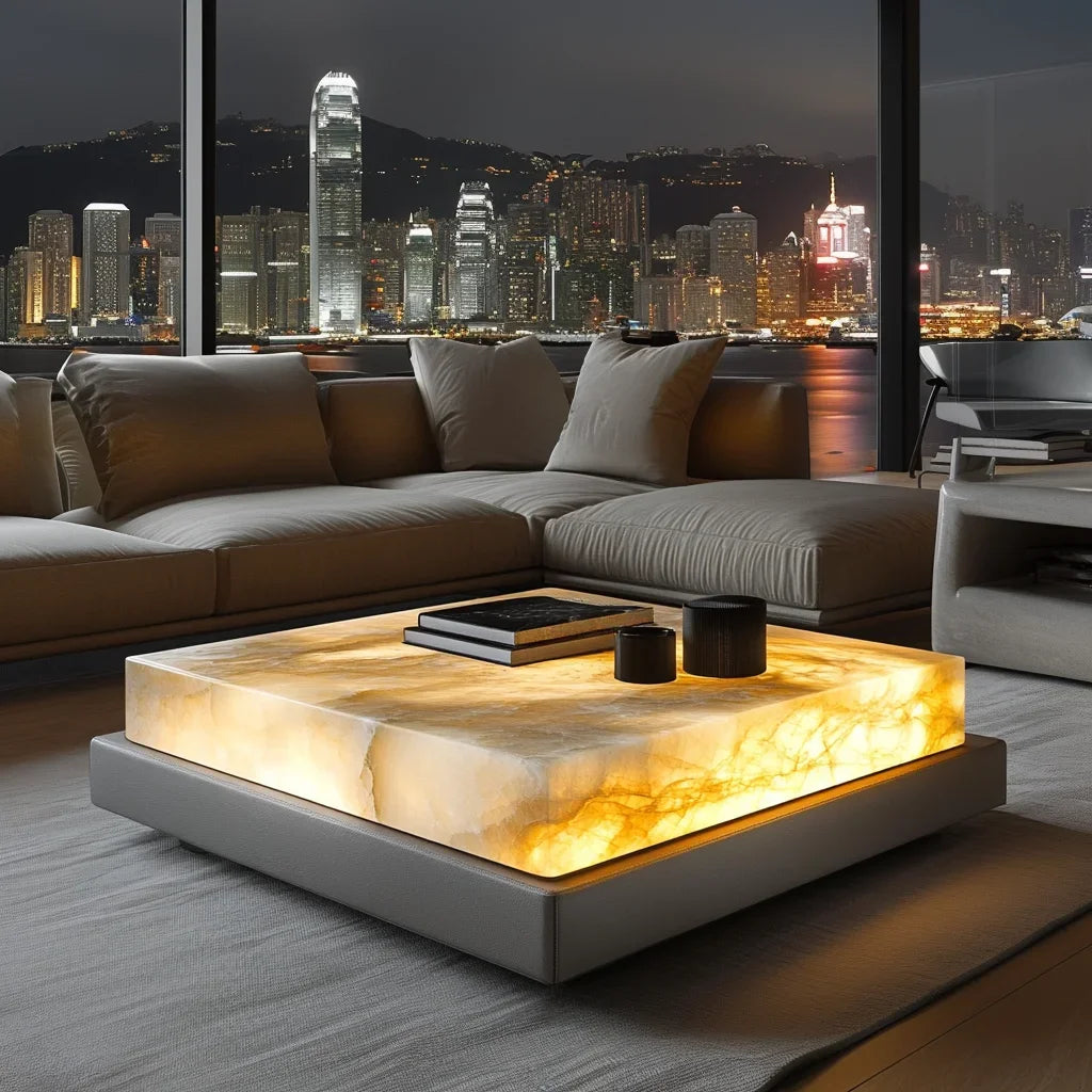 Modern living room with a sectional sofa and illuminated coffee table, featuring a cityscape view.