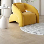Yellow armchair in a modern room with a white side table and large window.