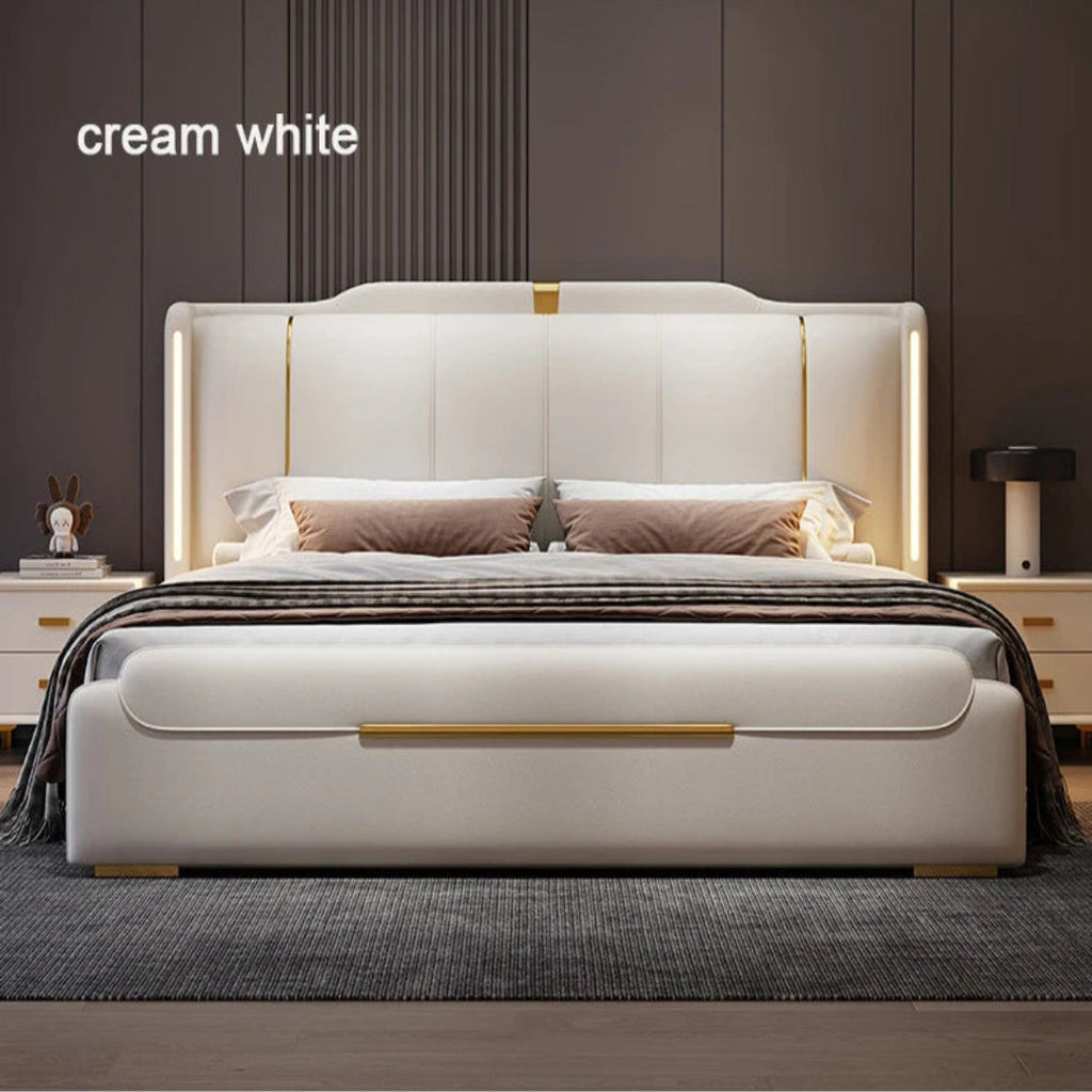 Cream white bed with gold accents in a bedroom setting