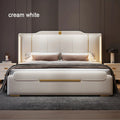 Cream white bed with gold accents in a bedroom setting