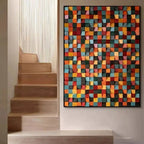 Colorful geometric wall art above a staircase
