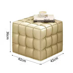 Beige cube ottoman with dimensions on a white background