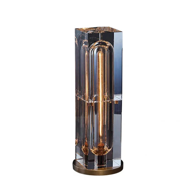 Modern table lamp with glass shade and metallic base on a white background
