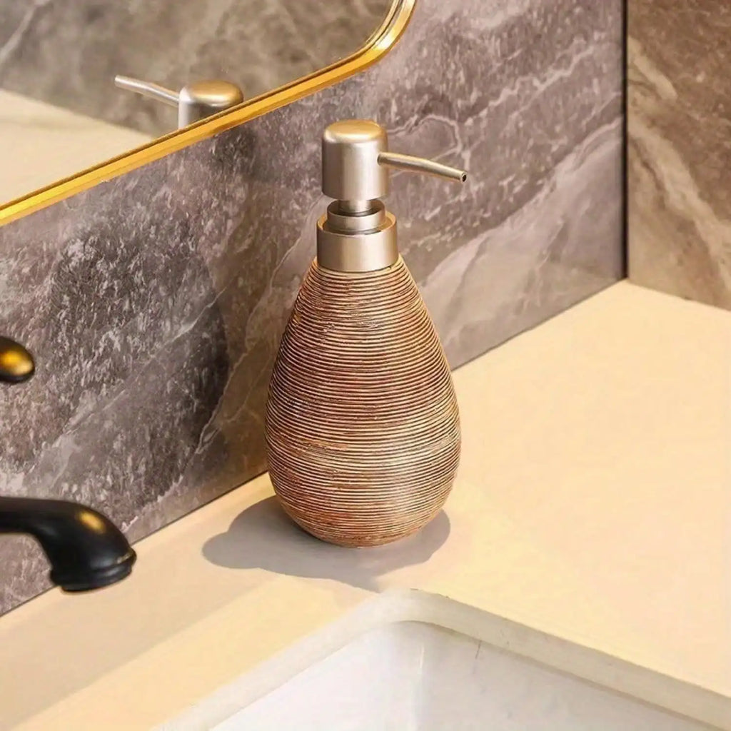 Decorative soap dispenser on a bathroom counter with marble wall in the background