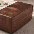 Wooden ottoman on a carpeted floor with a cup and magazine in the background.