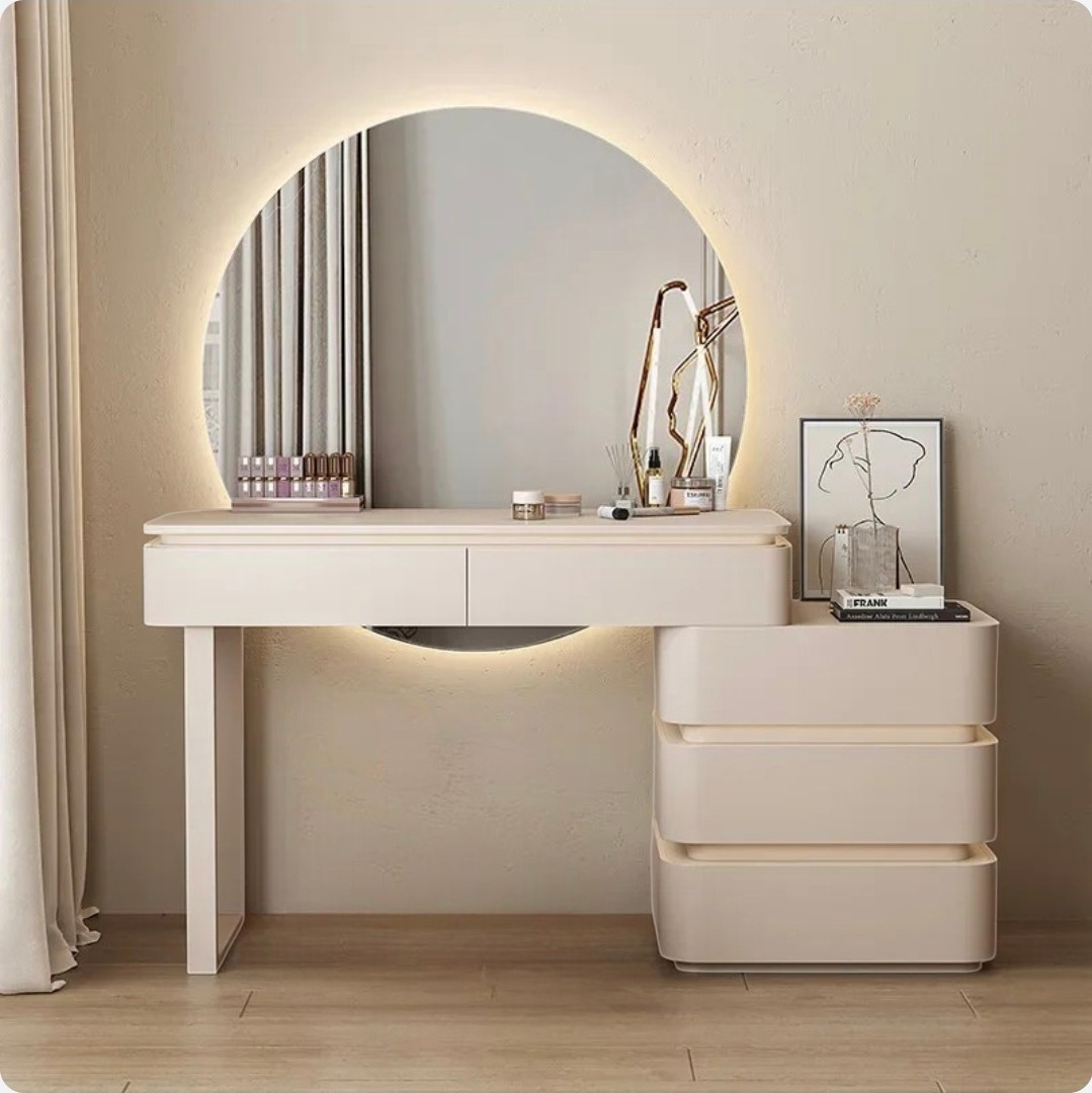Beige vanity table with mirror and drawers in a room setting