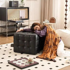 Woman resting on a black ottoman in a stylish living room.