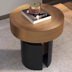 Round wooden side table with black base on a carpeted floor