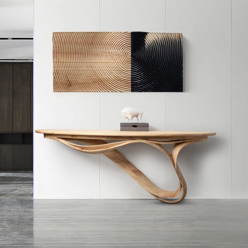 Wooden console table with abstract wall art in a modern interior setting