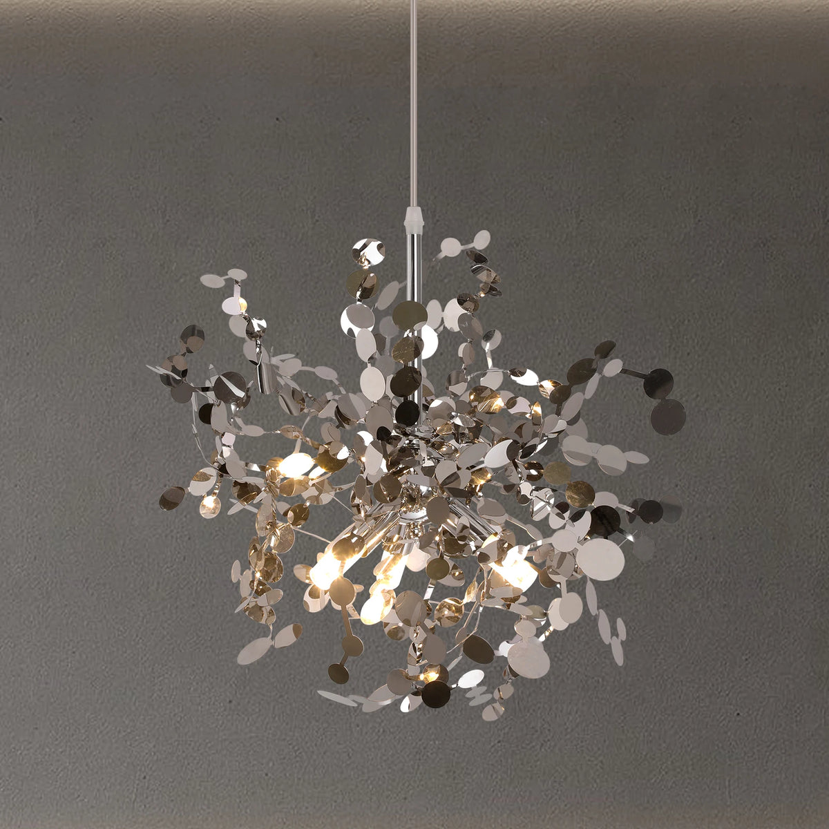 Chandelier with metallic leaves on a gray background