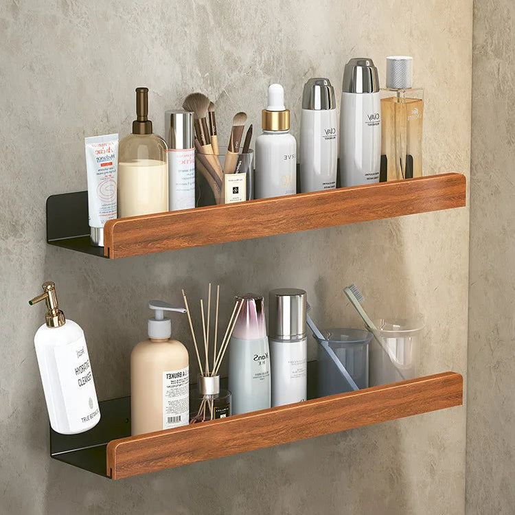 Wooden shelves with various bathroom products against a neutral wall.