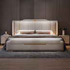 Modern bedroom with a beige upholstered bed, nightstands, and decorative items.