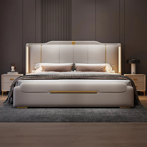 Modern bedroom with a beige upholstered bed, nightstands, and decorative items.