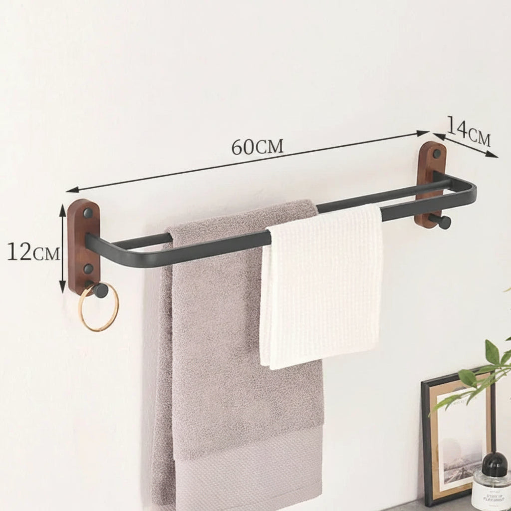 Towel rack with towels on a white wall, showing dimensions.
