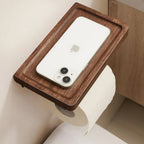 Wooden sunken storage table attached to a wall with a phone on it, preventing articles from dropping.