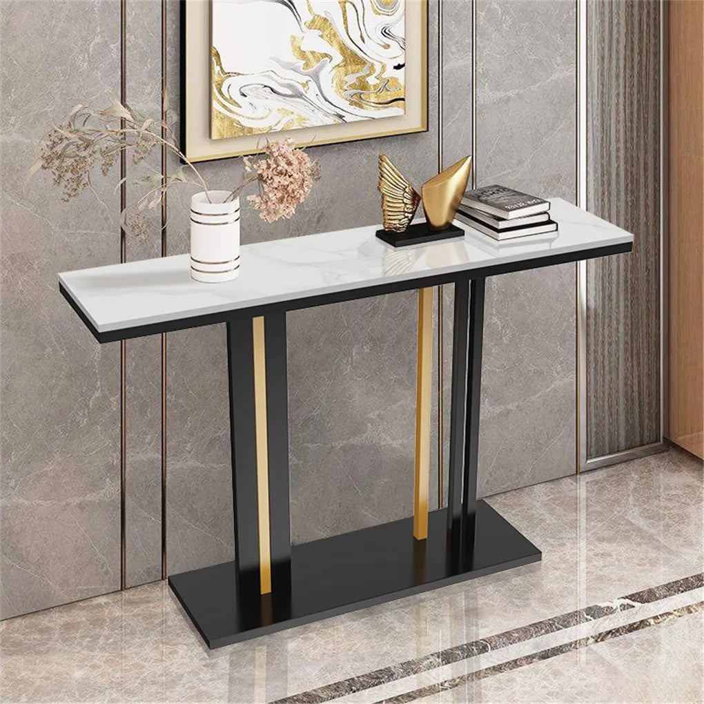 Console table with marble top and gold accents against a gray wall.