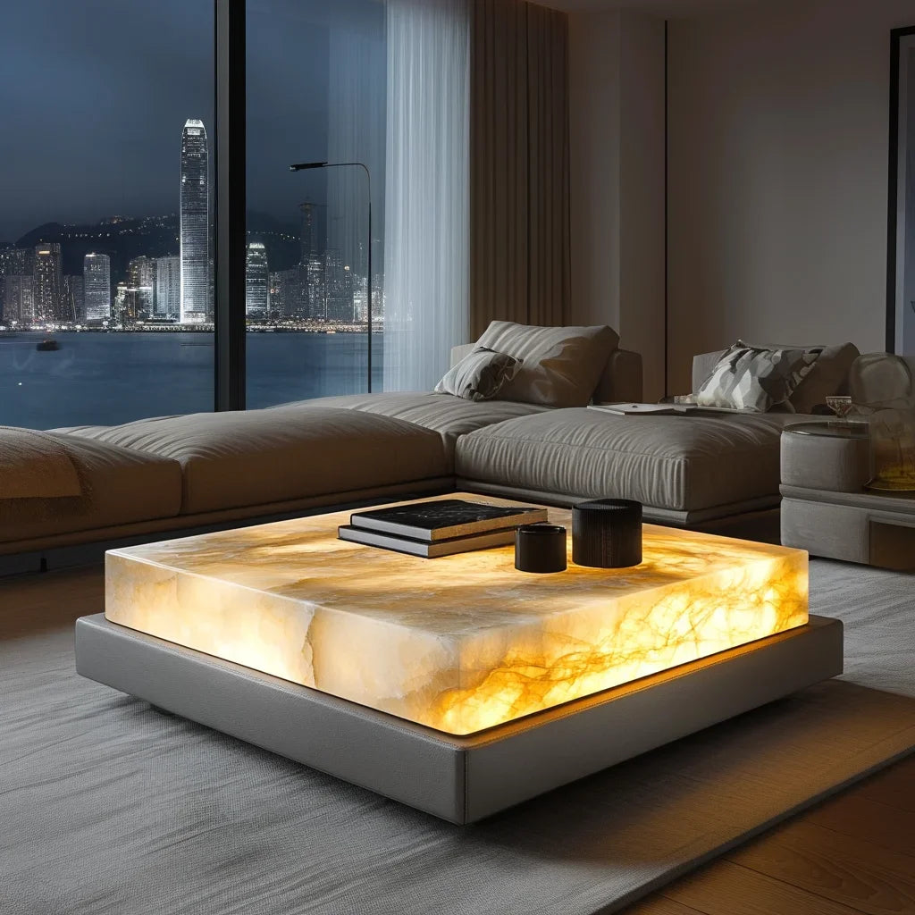 Modern living room with a illuminated coffee table and cityscape view.