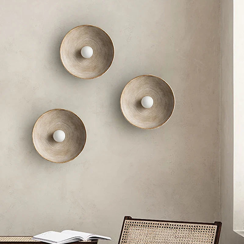 Desert Scandi wall lamp with a minimalist metal design and warm white LED lighting for modern bedrooms and living spaces.
