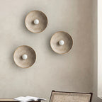 Desert Scandi wall lamp with a minimalist metal design and warm white LED lighting for modern bedrooms and living spaces.