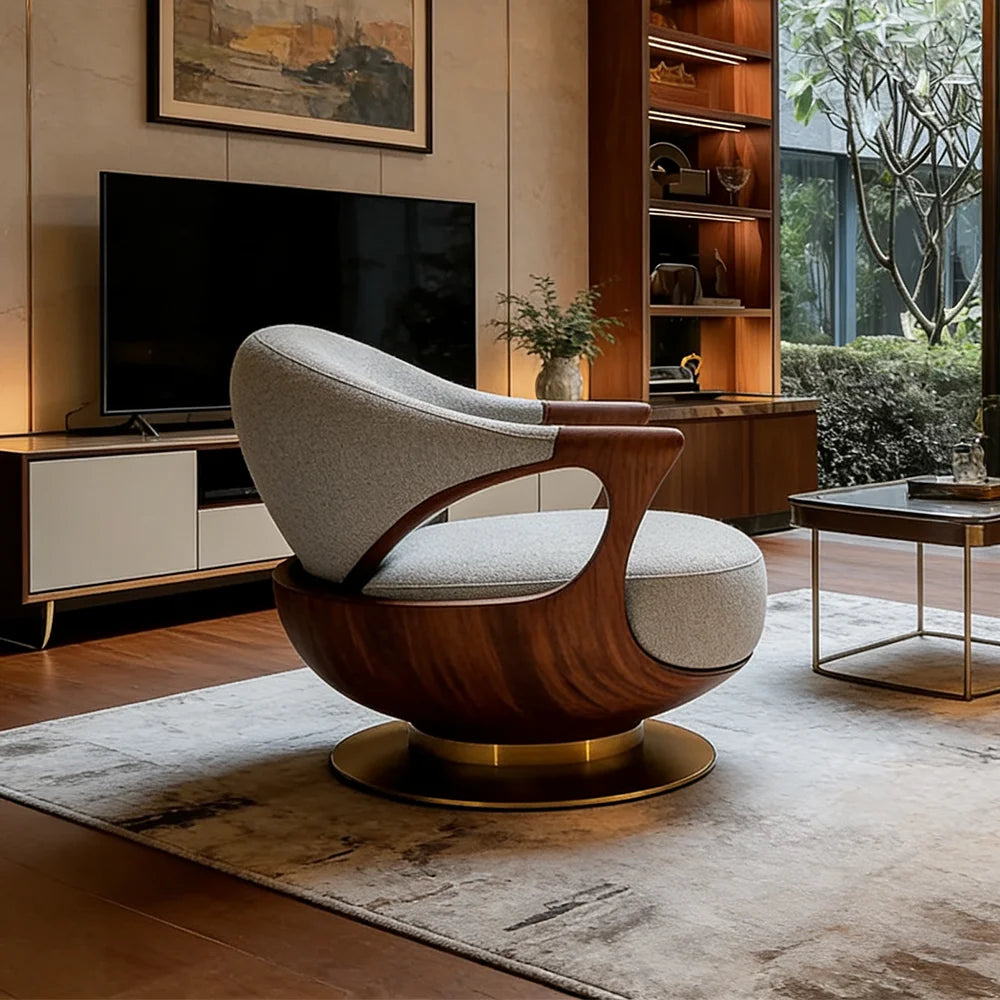Modern armchair in a living room setting with a television and decor.