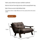 Brown leather armchair with dimensions on a white background