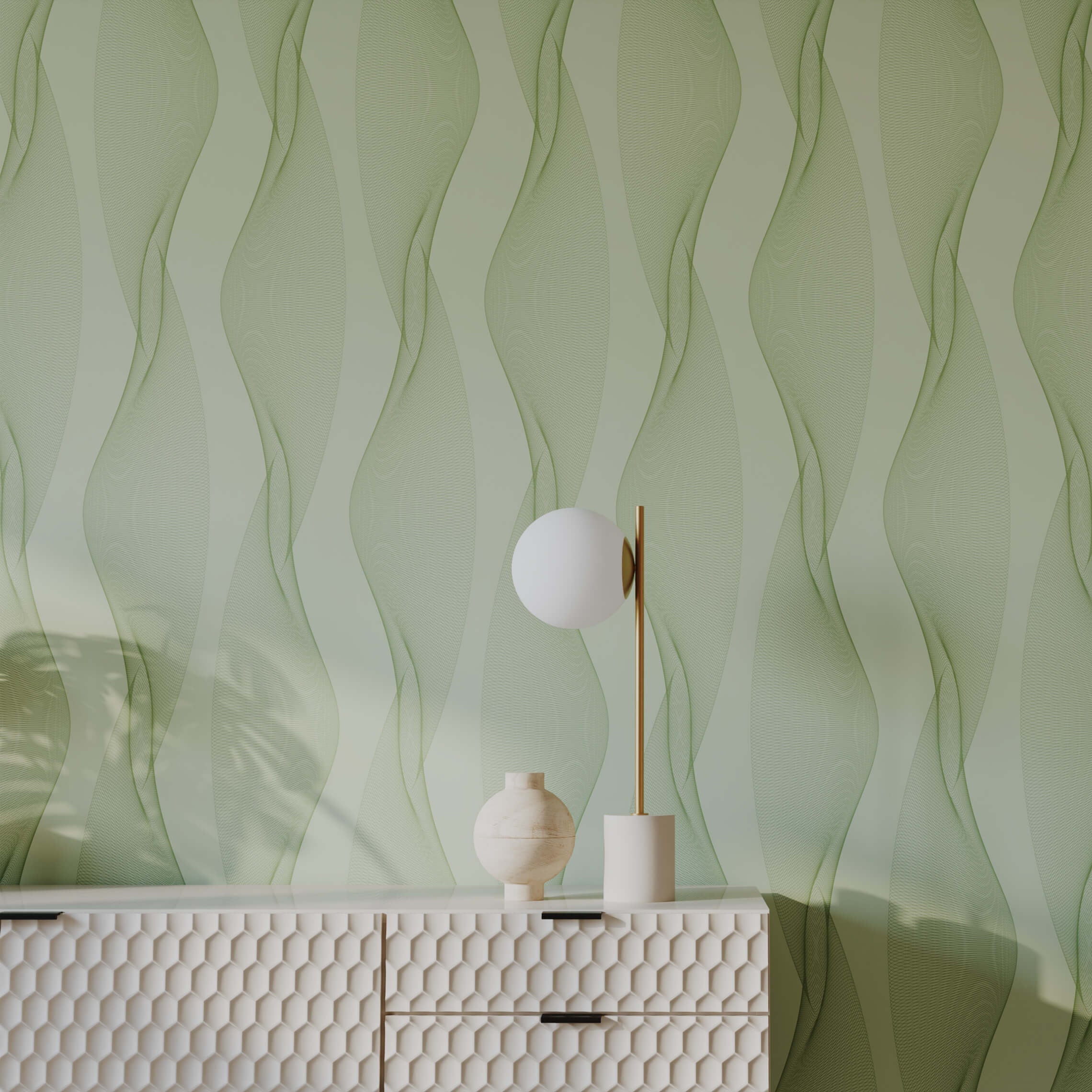 Decorative lamp and vase on a textured white console table against a green wavy patterned wall.